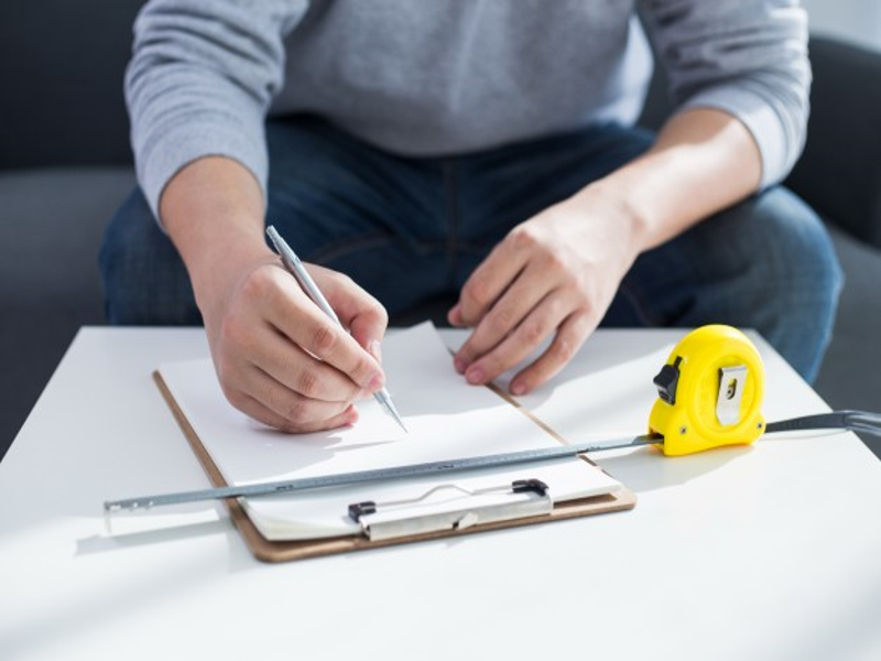 Taking measurements to create a piece of furniture