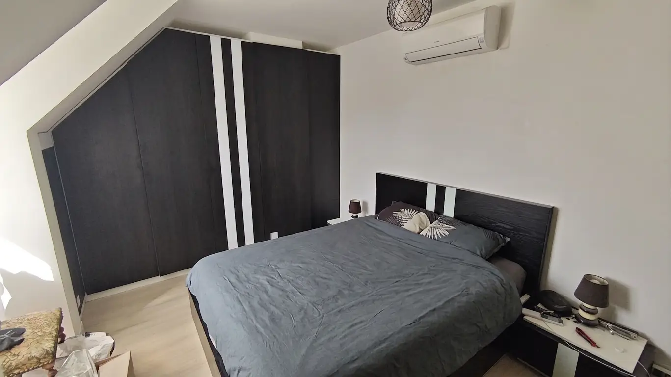 Custom Under-Slope Storage Solution for a Bedroom