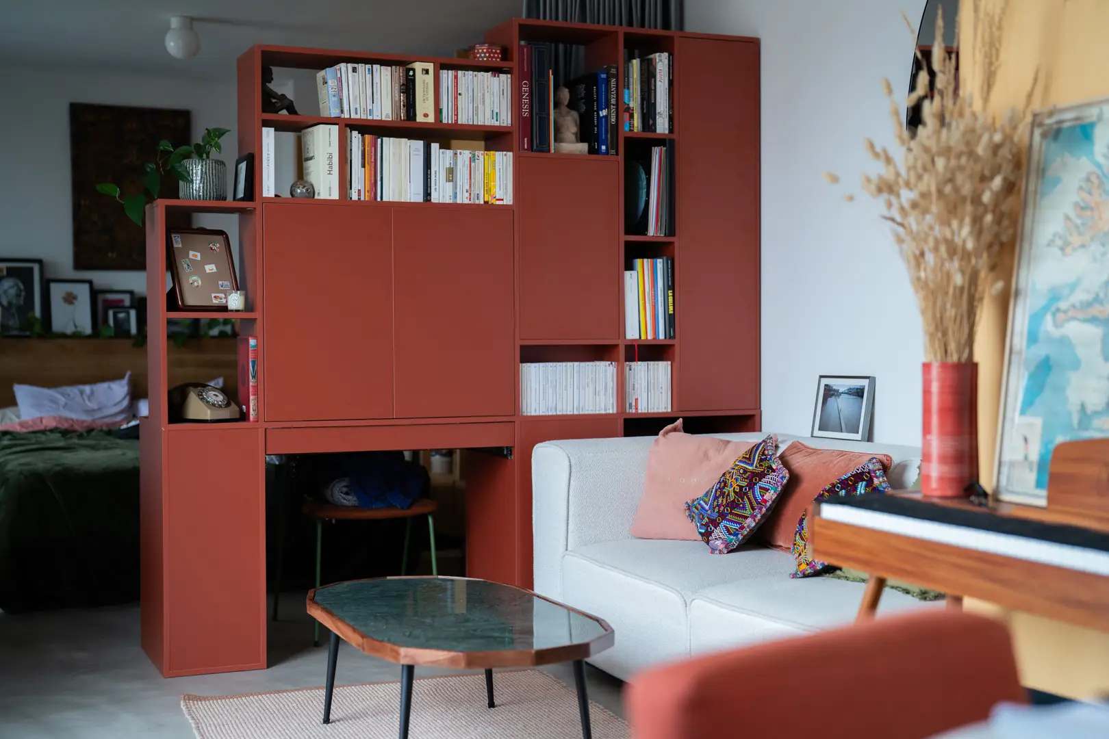 Custom-made screen divider unit with desk and variable-height bookcase