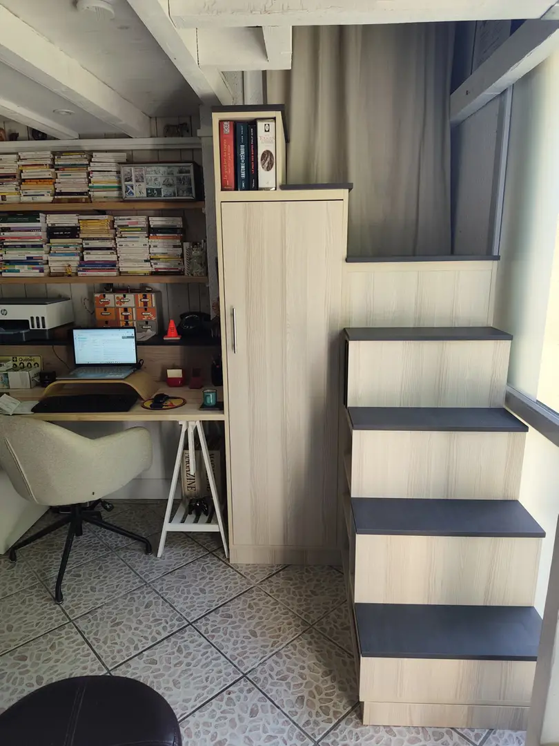 Custom-made winder staircase storage unit with cupboard