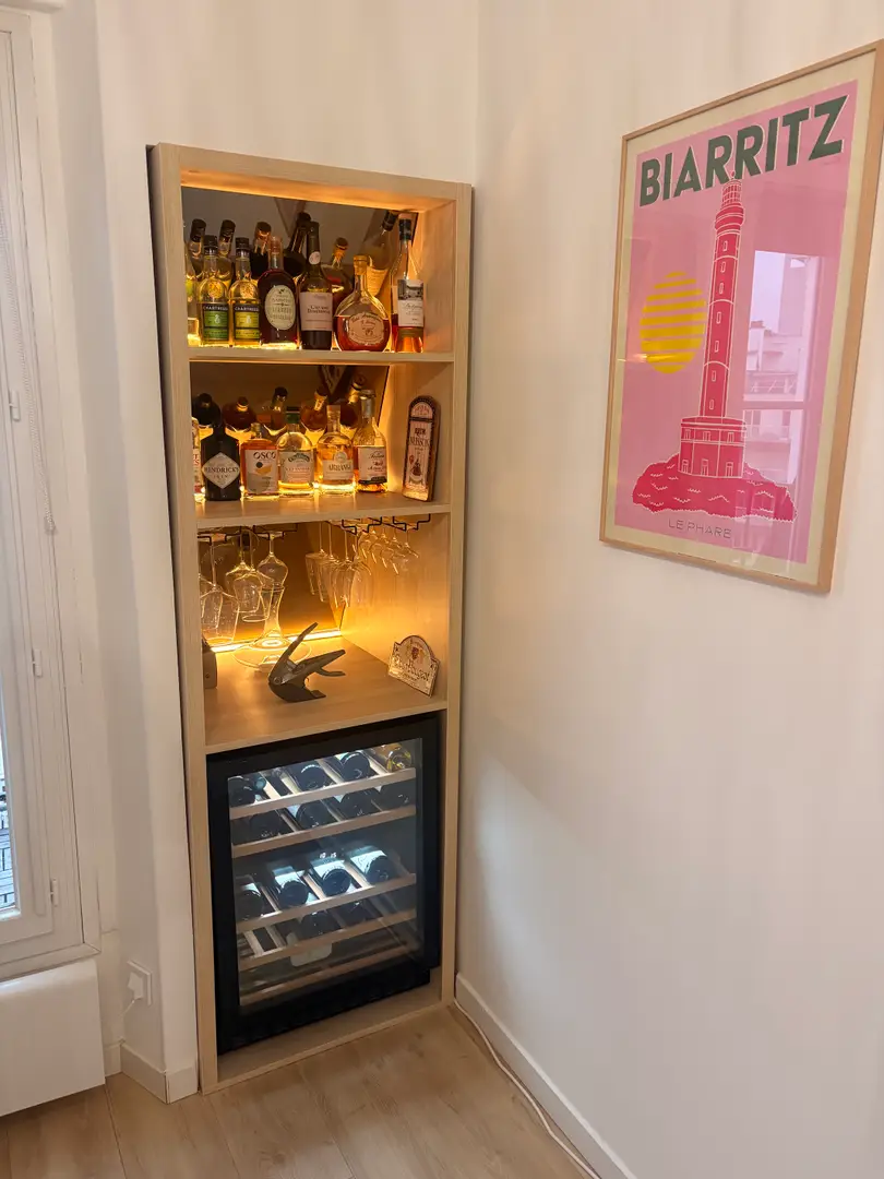 Custom-made under-sloped furniture for wine and spirits cellar