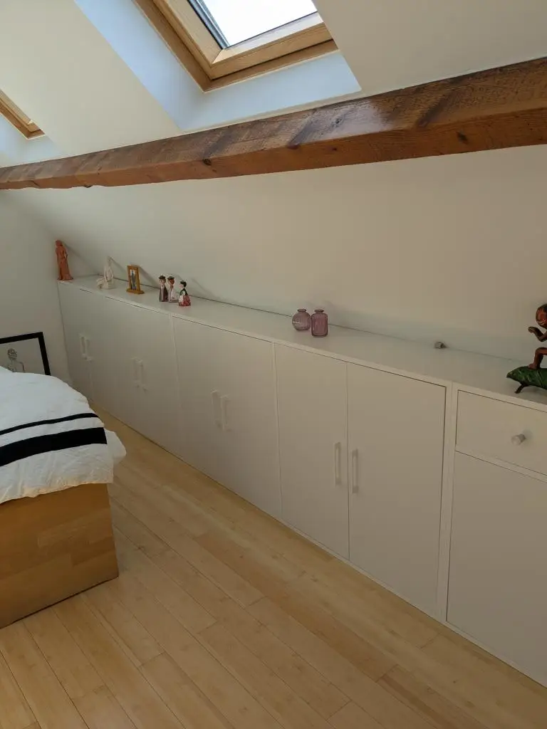 Low sloping back cabinet for attic bedroom